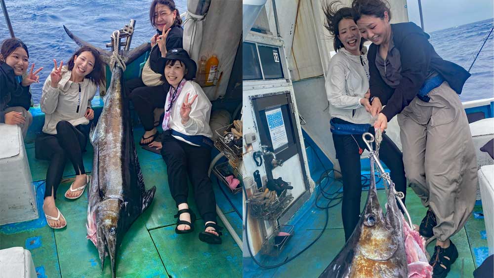 沖縄のトローリングでカジキを釣り上げた4人の女性